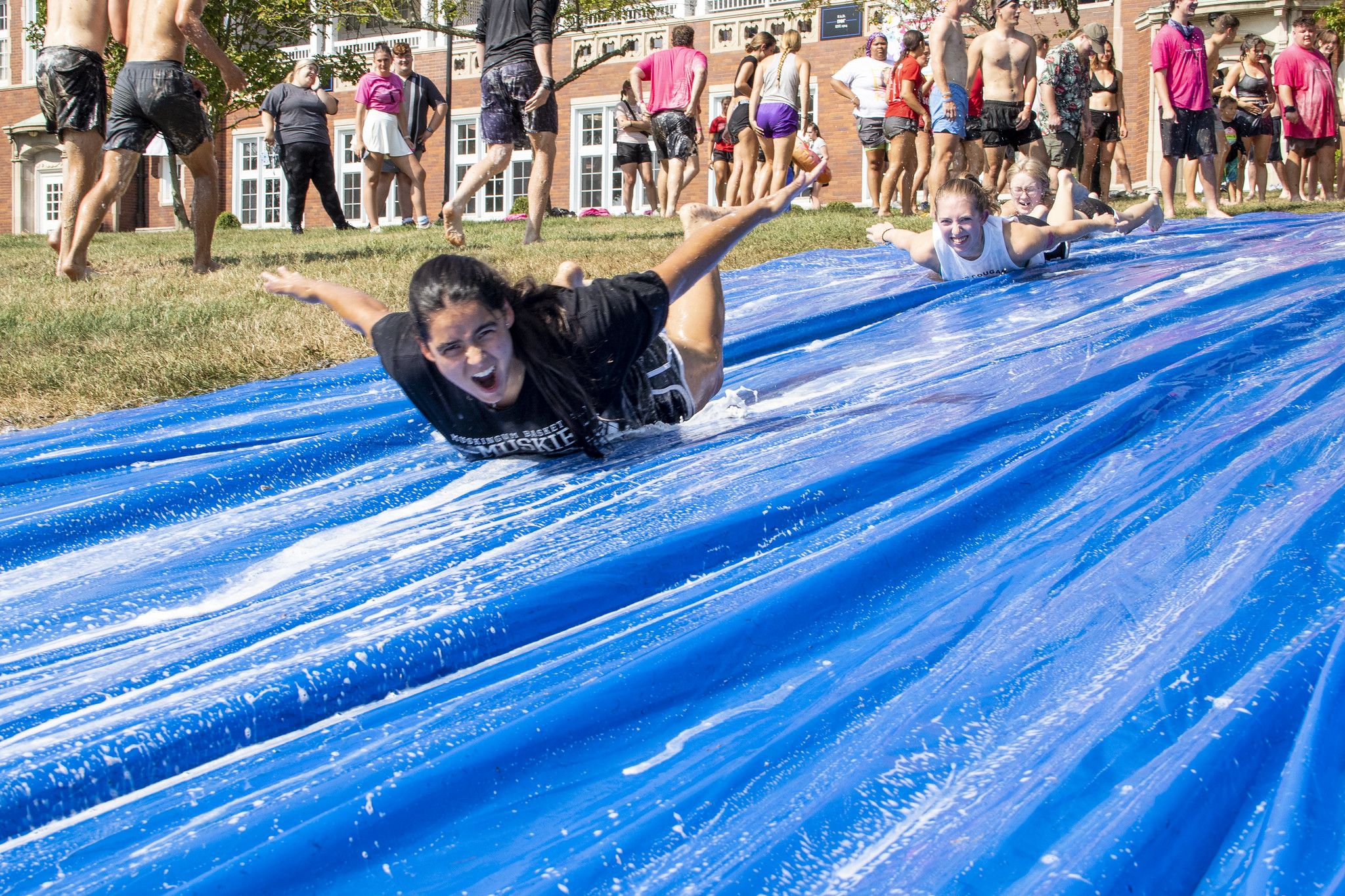 Students on a slip 'n slide